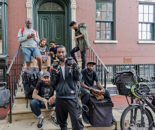 Cycle couriers in  Bleecker Street, Manhattan, New York 2017